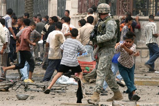 Iraqi Boy Hides Behind US Soldier In Baghdad