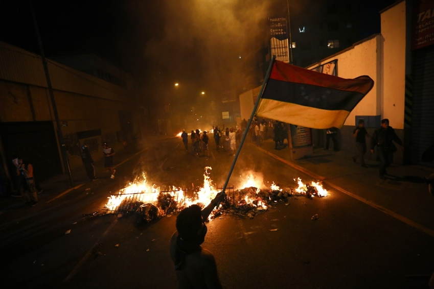 Venezuela Protests Fire Flag